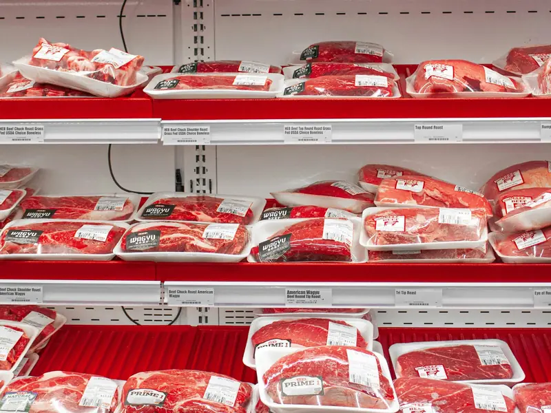 Packaged meat on supermarket shelves