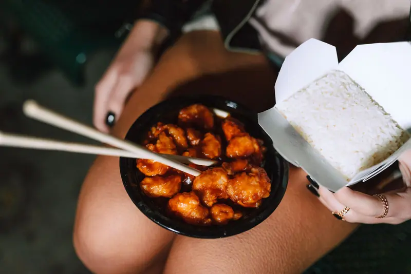 A Chinese take-out meal with chopsticks